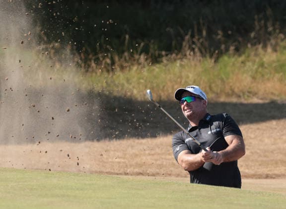New Zealand s Ryan Fox hits out of the bunker on the sixteenth hole at the 154th Open Championship at Royal Birkdale in Southport, on Sunday, July 19, 2026. Cox won the tournament with a score of ten under par.  LON2026071922 HUGOxPHILPOTT