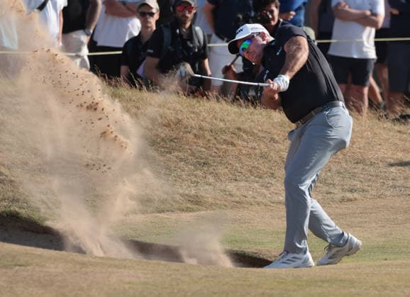 New Zealand s Ryan Fox hits out of the bunker on the 15th hole at the 154th Open Championship at Royal Birkdale in Southport, on Sunday, July 19, 2026. Cox won the tournament with a score of ten under par.  LON2026071926 HUGOxPHILPOTT