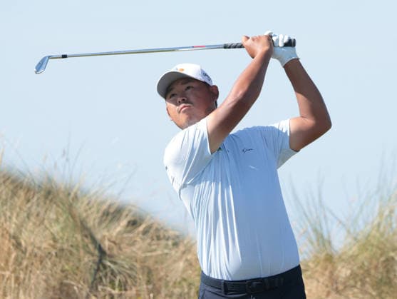 South Korea s Si Woo Kim drives on the 13th hole at the 154th Open Championship at Royal Birkdale in Southport, on Sunday, July 19, 2026. Cox won the tournament with a score of ten under par.  LON2026071933 HUGOxPHILPOTT