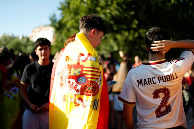 July 19, 2026, Madrid, Madrid, Spain: Thousands of Spanish soccer fans gather at the Puente del Rey esplanade to watch the highly anticipated 2026 World Cup Final match being played between Spain and Argentina on a giant screen installed by the Madrid City Council. The enthusiastic supporters braved the intense summer heat of the capital, arriving with hats, their faces painted in the national colors, and waving flags to passionately cheer for the Spanish national team, Nationalteam As the historic championship clash between the European and South American powerhouses unfolded, the atmosphere in the Madrid Rio park transformed into a tense and vibrant sea of red and yellow. The devoted crowd experienced every crucial play, foul, and shot on goal with overwhelming collective emotion and anxiety, dreaming of lifting the coveted trophy. Madrid Spain - ZUMAo127 20260719_zep_o127_002 Copyright: xHugoxOrtunox