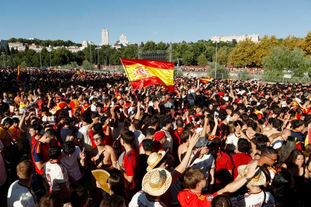 July 19, 2026, Madrid, Madrid, Spain: Thousands of Spanish soccer fans gather at the Puente del Rey esplanade to watch the highly anticipated 2026 World Cup Final match being played between Spain and Argentina on a giant screen installed by the Madrid City Council. The enthusiastic supporters braved the intense summer heat of the capital, arriving with hats, their faces painted in the national colors, and waving flags to passionately cheer for the Spanish national team, Nationalteam As the historic championship clash between the European and South American powerhouses unfolded, the atmosphere in the Madrid Rio park transformed into a tense and vibrant sea of red and yellow. The devoted crowd experienced every crucial play, foul, and shot on goal with overwhelming collective emotion and anxiety, dreaming of lifting the coveted trophy. Madrid Spain - ZUMAo127 20260719_zep_o127_017 Copyright: xHugoxOrtunox
