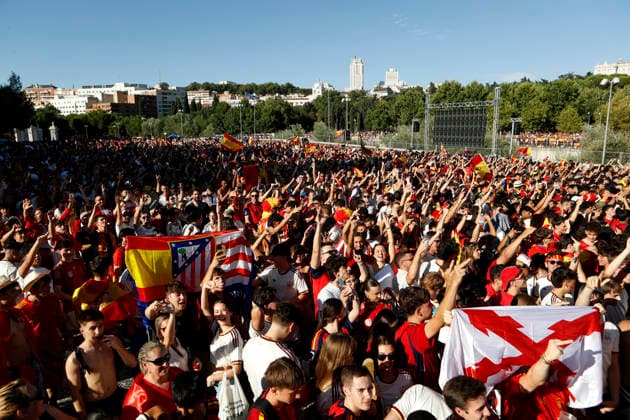 July 19, 2026, Madrid, Madrid, Spain: Thousands of Spanish soccer fans gather at the Puente del Rey esplanade to watch the highly anticipated 2026 World Cup Final match being played between Spain and Argentina on a giant screen installed by the Madrid City Council. The enthusiastic supporters braved the intense summer heat of the capital, arriving with hats, their faces painted in the national colors, and waving flags to passionately cheer for the Spanish national team, Nationalteam As the historic championship clash between the European and South American powerhouses unfolded, the atmosphere in the Madrid Rio park transformed into a tense and vibrant sea of red and yellow. The devoted crowd experienced every crucial play, foul, and shot on goal with overwhelming collective emotion and anxiety, dreaming of lifting the coveted trophy. Madrid Spain - ZUMAo127 20260719_zep_o127_030 Copyright: xHugoxOrtunox