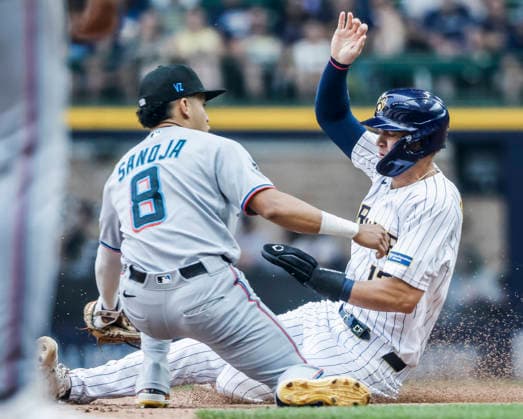 Miami Marlins shortstop Javier Sanoja (L) tags out Milwaukee Brewers pinch hitter Cooper Pratt on an attempted second base steal in the seventh inning of the MLB, Baseball Herren, USA game between the Miami Marlins and the Milwaukee Brewers at American Family Field in Milwaukee, Wisconsin on Sunday July 19, 2026.  MIL20260719818 TANNENxMAURY