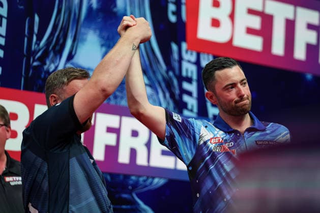 RECORD DATE NOT STATED 20th July 2026, Winter Gardens, Blackpool, Lancashire, England; 2026 Betfred World Matchplay Darts, Day Three; Luke Humphries holding Cameron Menzies hand up AidanxHunter