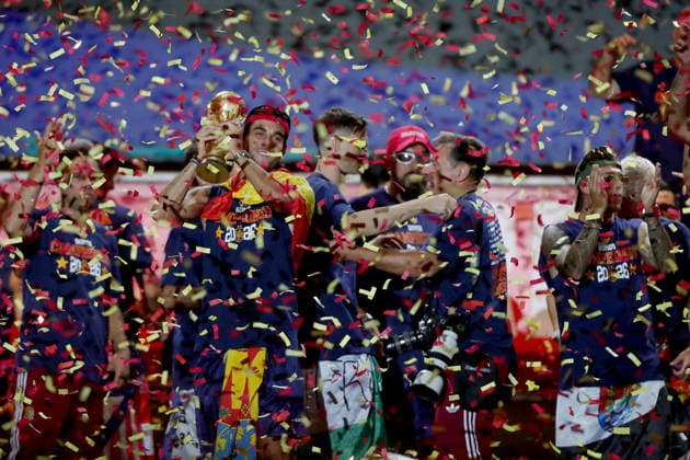 July 20, 2026, Madrid, Madrid, Spain: Spanish forward FERRAN TORRES kisses and lifts the 2026 World Cup trophy surrounded by his teammates on the celebration stage at Plaza de Cibeles. Despite facing heavy public criticism for his performance during the early matches of the tournament, FERRAN TORRES secured his place in Spanish soccer history by scoring the historic winning goal in the 106th minute of the final against Argentina. Up to two million fans flooded the streets of the capital, with 120,000 supporters packing the iconic square, to honor the national team, Nationalteam and witness their heroes commemorate the much-anticipated conquest of their second star. Madrid Spain - ZUMAo127 20260720_zep_o127_253 Copyright: xHugoxOrtunox