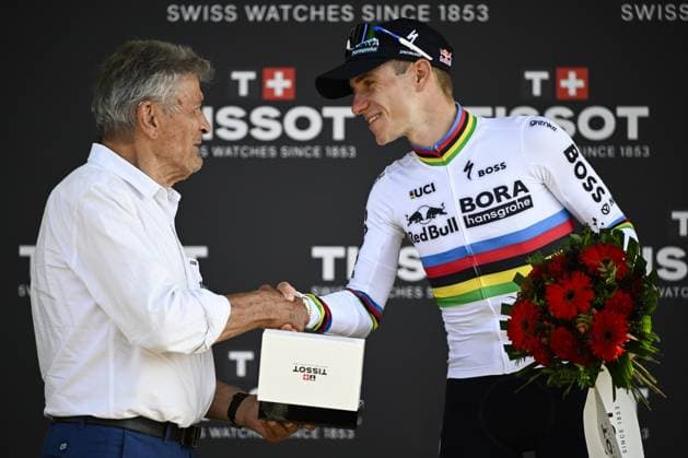 Former French cyclist Bernard Thevenet and Belgian Remco Evenepoel of Red Bull-BORA-hansgrohe pictured on the podium after the stage 16 of the 2026 Tour de France cycling race, an individual Time Trial stage of 26km from Evian-les-Bains to Thonon-les-Bains, on Tuesday 21 July 2026. The 113th edition of the Tour de France starts on Saturday 4 July in Barcelona, Spain, and will finish in Paris, France on the 26th of July. JASPERxJACOBS  x181687252x