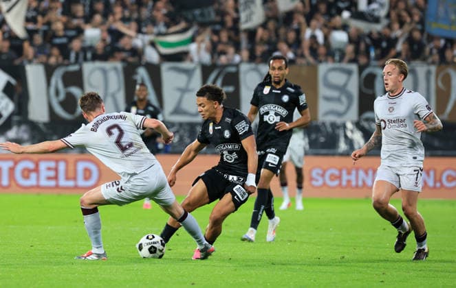 SOCCER - UEFA CL, Sturm vs Hearts GRAZ,AUSTRIA,21.JUL.26 - SOCCER - UEFA Champions League, qualification, SK Sturm Graz vs Heart of Midlothian FC. Image shows Christian Borchgrevink (Hearts), Jacob Peter Hoedl (Sturm) and Calvin Miller (Hearts).  GEPAxpictures xWolfgangxGrebien