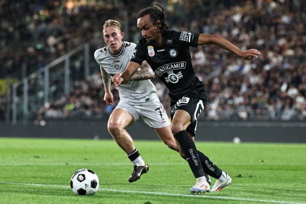SOCCER - UEFA CL, Sturm vs Hearts GRAZ,AUSTRIA,21.JUL.26 - SOCCER - UEFA Champions League, qualification, SK Sturm Graz vs Heart of Midlothian FC. Image shows Calvin Miller (Hearts) and Emran Soglo (Sturm).  GEPAxpictures xChrisxBauer