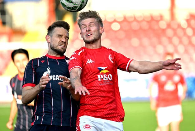 UEFA Champions League Second Qualifying Round First Leg, Inver Park, Belfast, Northern Ireland 21 7 2026 Larne vs Crvena Zvezda Larnes Dylan Sloan with Crvena Zvezda™s Timi Elsnik Dylan Sloan with Timi Elsnik 21 7 2026  Copyright: xx Larne v Crvena Zvezda-005