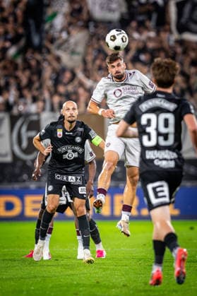STURM GRAZ - HEARTS Jon Gorenc Stankovic of Sturm and Claudio Braga of Hearts during the first leg of second qualifying round of UEFA Champions League football match between Sturm Graz and Heart of Midlothian FC at the Merkur Arena (Stadion Graz Liebenau). Graz, Austria, July 21, 2026. Photo by Branislav Racko Copyright: xx 080A1797