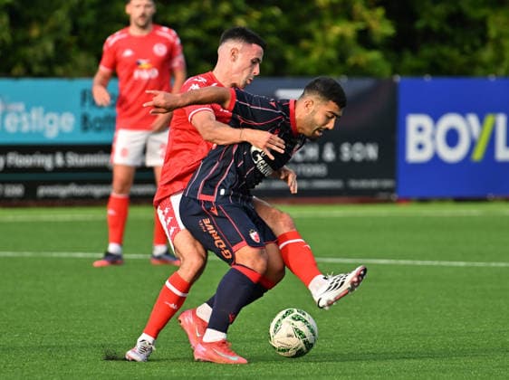 UEFA Champions League Second Qualifying Round First Leg, Inver Park, Belfast, Northern Ireland 21 7 2026 Larne vs Crvena Zvezda Larne™s Jordan McEneff with Crvena Zvezda™s Mohammed Abu Fani Jordan McEneff with Mohammed Abu Fani 21 7 2026  Copyright: xx Larne v Crvena Zvezda-009
