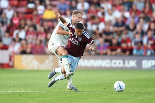Andrew Dallas of Walsall brings down Joao Gomes of Aston Villa. Walsall v Aston Villa, Pre Season Friendly, Football, Pallet-Track Bescot Stadium, Walsall, UK - 21 Jul 2026Walsall Pallet-Track Bescot Stadium United Kingdom EDITORIAL USE ONLY No use with unauthorised audio, video, data, fixture lists, club league logos or live services. Online in-match use limited to 120 images, no video emulation. No use in betting, games or single club league player publications.  Copyright: xRyanxBrowne Shutterstockx 16999236ag