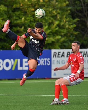 UEFA Champions League Second Qualifying Round First Leg, Inver Park, Belfast, Northern Ireland 21 7 2026 Larne vs Crvena Zvezda Larnes Chris Gallagher with Crvena Zvezda™s Mohammed Abu Fani Chris Gallagher with Mohammed Abu Fani 21 7 2026  Copyright: xx Larne v Crvena Zvezda-021