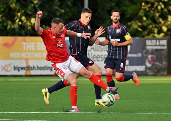 UEFA Champions League Second Qualifying Round First Leg, Inver Park, Belfast, Northern Ireland 21 7 2026 Larne vs Crvena Zvezda Larnes Chris Gallagher with Crvena Zvezda™s Bruno Duarte Chris Gallagher with Bruno Duarte 21 7 2026  Copyright: xx Larne v Crvena Zvezda-022