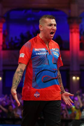 RECORD DATE NOT STATED 21st July 2026, Winter Gardens, Blackpool, Lancashire, England; 2026 Betfred World Matchplay Darts, Day Four; Nathan Aspinall reacts after taking out 170 to win a leg during his game against Luke Littler AidanxHunter