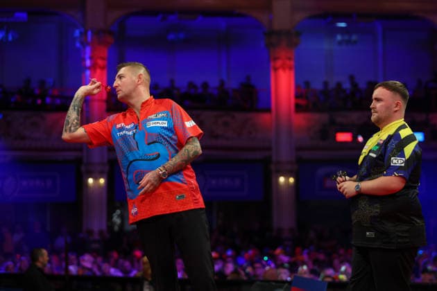 RECORD DATE NOT STATED 21st July 2026, Winter Gardens, Blackpool, Lancashire, England; 2026 Betfred World Matchplay Darts, Day Four; Nathan Aspinall in action at the oche as Luke Littler looks on AidanxHunter