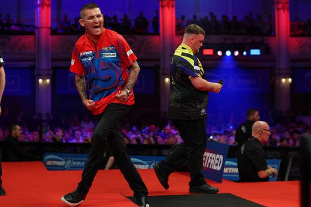 RECORD DATE NOT STATED 21st July 2026, Winter Gardens, Blackpool, Lancashire, England; 2026 Betfred World Matchplay Darts, Day Four; Nathan Aspinall celebrates winning a leg as Luke Littler returns to his table AidanxHunter