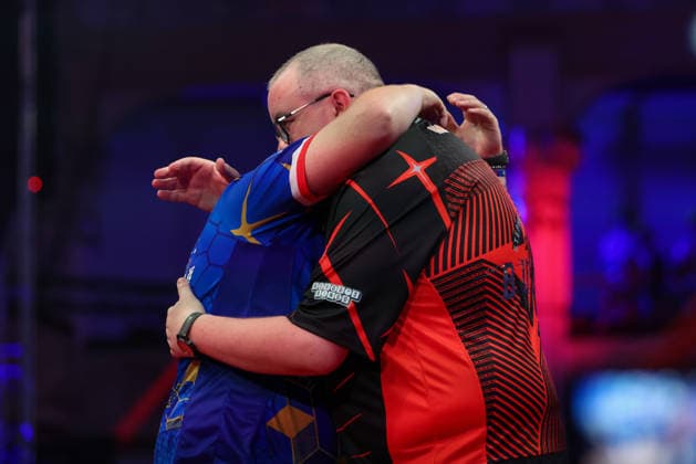 RECORD DATE NOT STATED 21st July 2026, Winter Gardens, Blackpool, Lancashire, England; 2026 Betfred World Matchplay Darts, Day Four; Josh Rock and Stephen Bunting hug after their game in which Josh Rock won AidanxHunter