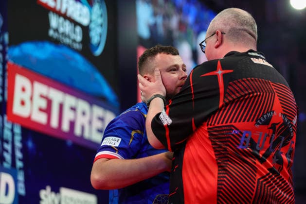 RECORD DATE NOT STATED 21st July 2026, Winter Gardens, Blackpool, Lancashire, England; 2026 Betfred World Matchplay Darts, Day Four; Stephen Bunting consoling an emotional Josh Rock after he won the game AidanxHunter