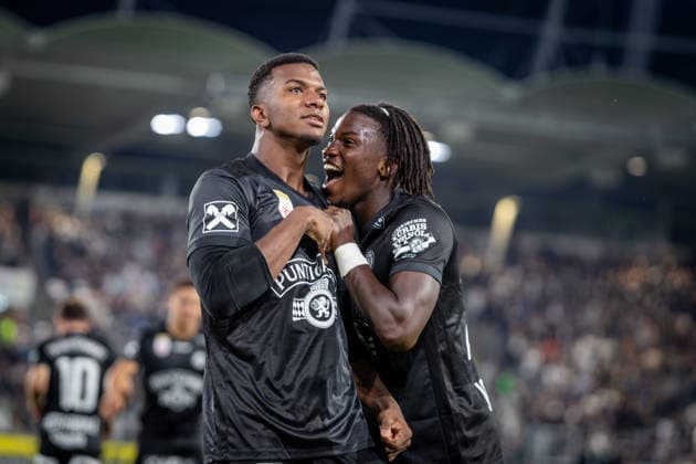 STURM GRAZ - HEARTS Jeyland Mitchell and Seedy Jatta of Sturm celebrate a goal during the first leg of second qualifying round of UEFA Champions League football match between Sturm Graz and Heart of Midlothian FC at the Merkur Arena (Stadion Graz Liebenau). Graz, Austria, July 21, 2026. Photo by Branislav Racko Copyright: xx _BRR6356