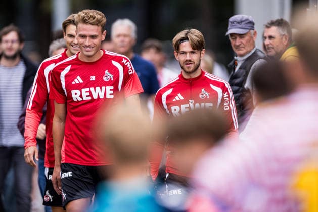 COLOGNE, GERMANY - JULY 22: Sebastian Sebulonsen (1. FC Koeln, 28), Jan Thielmann (1. FC Koeln, 29) walking through the crowd of fans before a training session of season 2026 27 at Geissbockheim on July 22, 2026 in Cologne, Germany. North Rhine Westphalia Germany Copyright: xSteffiexWunderlx
