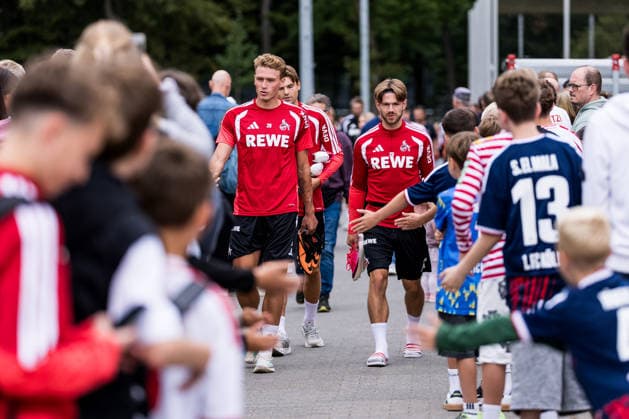 COLOGNE, GERMANY - JULY 22: Sebastian Sebulonsen (1. FC Koeln, 28) and Jan Thielmann (1. FC Koeln, 29) walking through the crowd of fans before a training session of season 2026 27 at Geissbockheim on July 22, 2026 in Cologne, Germany. North Rhine Westphalia Germany Copyright: xSteffiexWunderlx