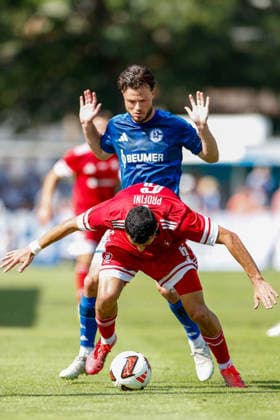 SOCCER - Schalke vs Kharkiv, test match KEMATEN,AUSTRIA,22.JUL.26 - SOCCER - 1. DFL, 1. Deutsche Bundesliga, Premjer-Liha, FC Schalke 04 vs FC Kharkiv, test match. Image shows Rafael Profini (Kharkiv) and Adrian Gantenbein (Schalke).  GEPAxpictures xMarkoxVulic