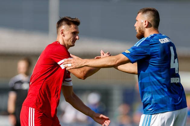 SOCCER - Schalke vs Kharkiv, test match KEMATEN,AUSTRIA,22.JUL.26 - SOCCER - 1. DFL, 1. Deutsche Bundesliga, Premjer-Liha, FC Schalke 04 vs FC Kharkiv, test match. Image shows Denys Antiukh (Kharkiv) and Hasan Kurucay (Schalke).  GEPAxpictures xMarkoxVulic
