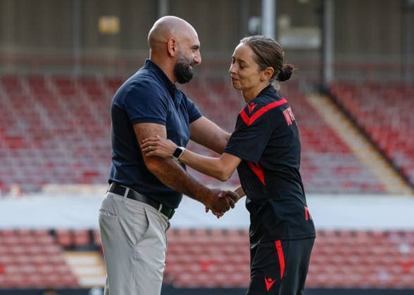 Wrexham, Wales, 22nd July 2026. Manuk Sargsyan head coach of Pyunik shakes hands with Jenny Sugarman manager of Wrexham ahead of the Pyunik v Wrexham Women UEFA Womens Champions League Qualifying match at The Racecourse, Wrexham. Picture credit should read: Cody Froggatt Sportimage EDITORIAL USE ONLY. No use with unauthorised audio, video, data, fixture lists, club league logos or live services. Online in-match use limited to 120 images, no video emulation. No use in betting, games or single club league player publications. SPI_003_CF_PYUNIK_V_WREXHAM_WOMEN SPI-4881-0003
