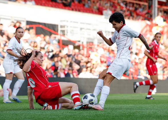 Wrexham, Wales, 22nd July 2026. Ava Suckley of Wrexham tackles Ani Ghukasyan of Pyunik during the Pyunik v Wrexham Women UEFA Womens Champions League Qualifying match at The Racecourse, Wrexham. Picture credit should read: Cody Froggatt Sportimage EDITORIAL USE ONLY. No use with unauthorised audio, video, data, fixture lists, club league logos or live services. Online in-match use limited to 120 images, no video emulation. No use in betting, games or single club league player publications. SPI_013_CF_PYUNIK_V_WREXHAM_WOMEN SPI-4881-0013