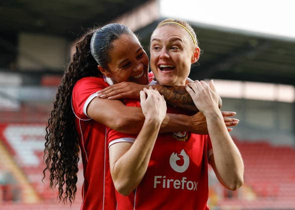 Wrexham, Wales, 22nd July 2026. Natasha Thomas and Jodie Bartle of Wrexham celebrate the full time result following the Pyunik v Wrexham Women UEFA Womens Champions League Qualifying match at The Racecourse, Wrexham. Picture credit should read: Cody Froggatt Sportimage EDITORIAL USE ONLY. No use with unauthorised audio, video, data, fixture lists, club league logos or live services. Online in-match use limited to 120 images, no video emulation. No use in betting, games or single club league player publications. SPI_028_CF_PYUNIK_V_WREXHAM_WOMEN SPI-4881-0028