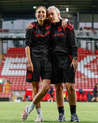 Wrexham, Wales, 22nd July 2026. Jenny Sugarman manager of Wrexham (left) and Rebecca Sawiuk assistant manager of Wrexham (right) celebrate the full time result following the Pyunik v Wrexham Women UEFA Womens Champions League Qualifying match at The Racecourse, Wrexham. Picture credit should read: Cody Froggatt Sportimage EDITORIAL USE ONLY. No use with unauthorised audio, video, data, fixture lists, club league logos or live services. Online in-match use limited to 120 images, no video emulation. No use in betting, games or single club league player publications. SPI_034_CF_PYUNIK_V_WREXHAM_WOMEN SPI-4881-0034
