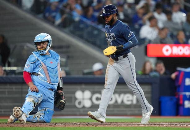July 22, 2026, Toronto, On, CANADA: Tampa Bay Rays Cedric Mullins (31) scores a run after a walk while the bases were loaded as Toronto Blue Jays catcher Alejandro Kirk (30) looks on during sixth inning MLB, Baseball Herren, USA baseball action in Toronto on Wednesday, July 22, 2026. Canada News - July 22, 2026  - ZUMAc35_ 20260722_zaf_c35_124 Copyright: xNathanxDenettex