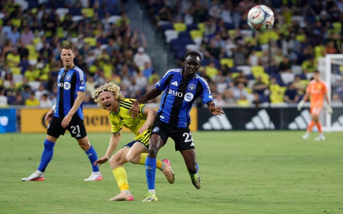 NASHVILLE, TN - JULY 22: CF MontrÃ al midfielder Victor Loturi (22) fouls Nashville SC midfielder Edvard Tagseth (20) as they battle for a pass during a match between Nashville SC and CF MontrÃ al, July 22, 2026 at GEODIS Park in Nashville, Tennessee. (Photo by Matthew Maxey Icon Sportswire) SOCCER: JUL 22 MLS, Fussball Herren, USA Nashville SC vs CF Montreal EDITORIAL USE ONLY Icon26072206
