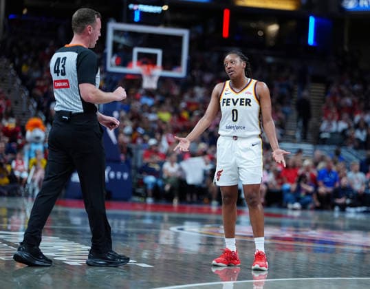 INDIANAPOLIS, IN - JULY 22: Indiana Fever guard Kelsey Mitchell (0) voices her displeasure over a referee™s call during a game against the Connecticut Sun on July 22, 2026, at Gainbridge Fieldhouse in Indianapolis, Indiana. (Photo by Brian Spurlock Icon Sportswire) WNBA, Basketball Damen, USA JUL 22 Connecticut Sun at Indiana Fever EDITORIAL USE ONLY Icon26072233