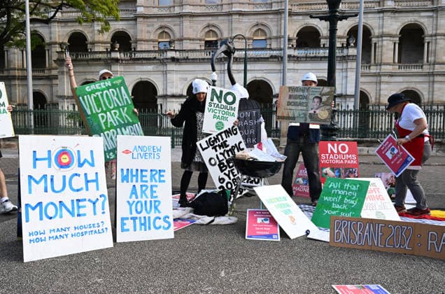 OLYMPICS MONEY BURNING 2032 BBQ, Protestors against the 2032 Brisbane Olympics are seen during a Olympics Money Burning BBQ protest that marks 6 years until the Brisbane 2032 Olympics, at Queensland Parliament House, in Brisbane, Thursday, July 23, 2026. ( NO ARCHIVING BRISBANE QUEENSLAND AUSTRALIA  Copyright: xDARRENxENGLANDx 20260723145598520948