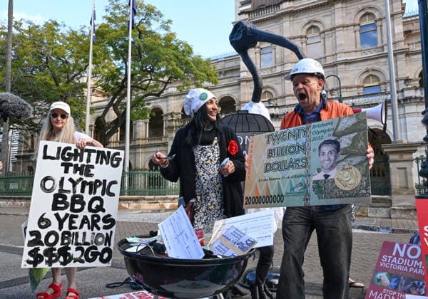 OLYMPICS MONEY BURNING 2032 BBQ, Protestors against the 2032 Brisbane Olympics are seen during a Olympics Money Burning BBQ protest that marks 6 years until the Brisbane 2032 Olympics, at Queensland Parliament House, in Brisbane, Thursday, July 23, 2026. ( NO ARCHIVING BRISBANE QUEENSLAND AUSTRALIA  Copyright: xDARRENxENGLANDx 20260723169078150160