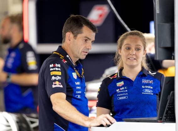 BUDAPEST - Chris Gent (Red Bull Racing mechanic) in conversation with Michaela Tennyson (Red Bull Racing pit crew) at the Hungaroring ahead of the Hungarian Grand Prix. SANDER KONING ANP xVIxANPxSportx xxANPxIVx 564130588 originalFilename: 564130588.jpg