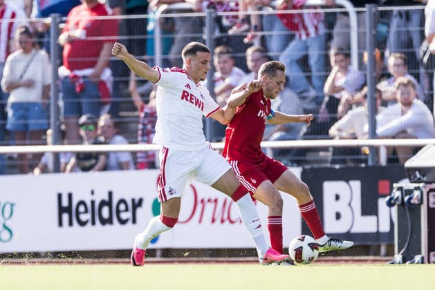 BERGISCH GLADBACH, GERMANY - JULY 23: Said El Mala (1. FC Koeln, 13) controls the ball against Jonas Ruecker (Rücker, Rucker, SV Bergisch Gladbach, 6) during the second friendly game of season 2026 27 between SV Bergisch Gladbach vs. 1. FC Koeln at BELKAW ARENA on July 23, 2026 in Bergisch Gladbach, Germany. North Rhine Westphalia Germany Copyright: xSteffiexWunderlx