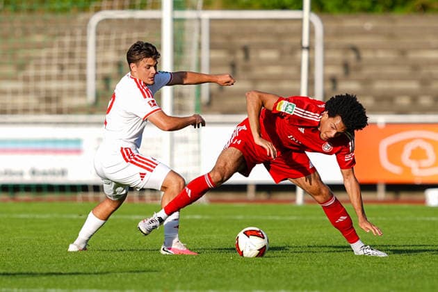 23.07.2026, xydrx, Fußball, Testspiel, SV Bergisch Gladbach 09 - 1.FC Köln, Saison 2026 2027, BELKAW-Arena: Patrik Kristal (1.FC Köln, 32) im Zweikampf gegen Eliot Albert (SV Bergisch Gladbach 09, 24) DFB regulations prohibit any use of photographs as image sequences and or quasi-video. *** July 23, 2026, xydrx, Soccer, Friendly Match, SV Bergisch Gladbach 09 vs. 1 FC Köln, 2026–2027 Season, BELKAW Arena: Patrik Kristal of 1 FC Köln, No. 32, in a tackle against Eliot Albert of SV Bergisch Gladbach 09; 24. DFB regulations prohibit any use of photographs as image sequences and or quasi-video Copyright: HMBxMedia YannisxDreimann