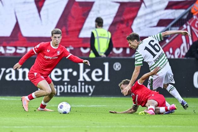 ENSCHEDE , 23-07-2026 , Stadium Grolsch Veste , season 2026 2027 , UEFA Europa League play-off football , match between FC Twente and Ferencvarosi , picture shows FC Twente player Ruud Nijstad and Ferencvarosi player Kristoffer Zachariassen Twente - Ferencvarosi  x205167589x Copyright: