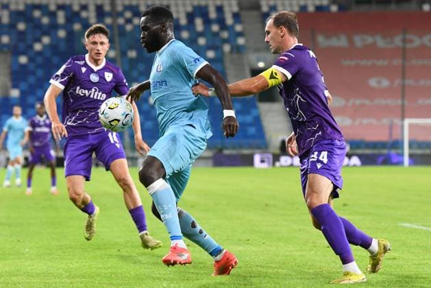 Gent s Wilfried Kanga and Cherkasy s Nazarii Muravskyi pictured in action during a soccer game between Ukrainian FC LNZ Cherkasy and Belgian KAA Gent, Thursday 23 July 2026 in Plock, Poland, the first leg of the second qualifying round for the UEFA Conference League. JILLxDELSAUX  x181871665x