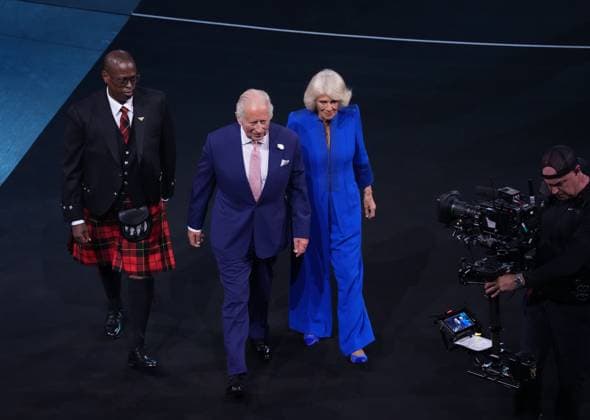 HRH King Charles III & Her Majesty Queen Camilla walk to the Royal Box after stepping out of The TARDIS to join Sir Chris Hoy on stage at the beginning of the opening ceremony. Glasgow 2026 Commonwealth Games, Day One, Glasgow, Scotland, UK - 23 Jul 2026Glasgow Scotland United Kingdom  Copyright: xStuartxWallace Shutterstockx 17002357ab