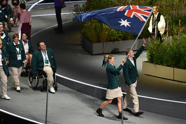 COM26 OPENING CEREMONY, Nina Kennedy carries the flag for Australia as they enter the stadium during the Opening Ceremony of the Glasgow 2026 Commonwealth Games at The Hydro in Glasgow, Scotland, Thursday, July 23, 2026. ( NO ARCHIVING, EDITORIAL USE ONLY GLASGOW UNITED KINGDOM  Copyright: xJOELxCARRETTx 20260724173999626193