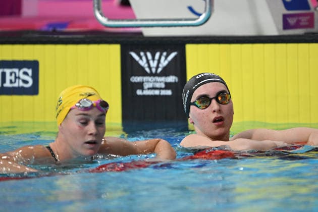 COM26 SWIMMING HEATS, Alex Perkins of Australia and Zoe Pedersen of New Zealand reacts following the Women™s 50m Butterfly heats at the Glasgow 2026 Commonwealth Games at the Tollcross International Swimming Centre in Glasgow, Scotland, Friday, July 24, 2026. ( NO ARCHIVING, EDITORIAL USE ONLY Glasgow Scotland United Kingdom  Copyright: xDEANxLEWINSx 20260724167457123630