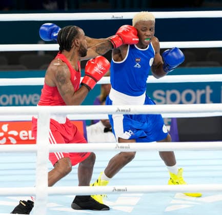 Commonwealth Games Day One Ziggy Agathe (Red) and Simamkele Dames take part in the Mens 65kg Boxing - Prelims during Day One of the 2026 Commonwealth Games at the SEC Centre in Glasgow, Scotland 24 07 2026 UK Newspapers OUT Copyright: xGrahamxGlendinningx FIL-23650-0010