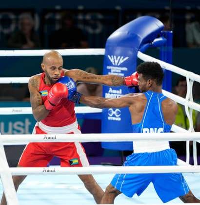 Commonwealth Games Day One Jovanie Bouzin (Red) and Afzal Khan take part in the Mens 65kg Boxing - Prelims during Day One of the 2026 Commonwealth Games at the SEC Centre in Glasgow, Scotland 24 07 2026 UK Newspapers OUT Copyright: xGrahamxGlendinningx FIL-23650-0019