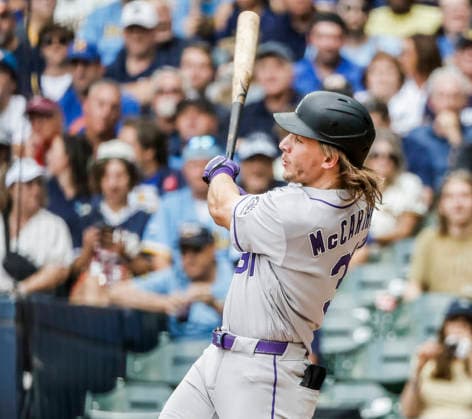 Colorado Rockies left fielder Jake McCarthy hits a triple in the third inning of the MLB, Baseball Herren, USA game between the Colorado Rockies and the Milwaukee Brewers at American Family Field in Milwaukee, Wisconsin on Friday July 24, 2026.  MIL20260724811 TANNENxMAURY