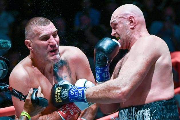 July 24, 2026, Pattaya, Chonburi, Thailand: Tyson Fury (L) and Mariusz Wach (R) exchanging punches during their heavyweight boxing bout. Tyson Fury defeats Mariusz Wach by corner retirement after seven rounds to win the WBC Humanitarian Belt at Max Muay Thai Stadium. Pattaya Thailand - ZUMAs197 20260724_aaa_s197_085 Copyright: xWasimxMatherx