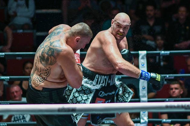 July 24, 2026, Pattaya, Chonburi, Thailand: Tyson Fury (L) and Mariusz Wach (R) exchanging punches during their heavyweight boxing bout. Tyson Fury defeats Mariusz Wach by corner retirement after seven rounds to win the WBC Humanitarian Belt at Max Muay Thai Stadium. Pattaya Thailand - ZUMAs197 20260724_aaa_s197_096 Copyright: xWasimxMatherx